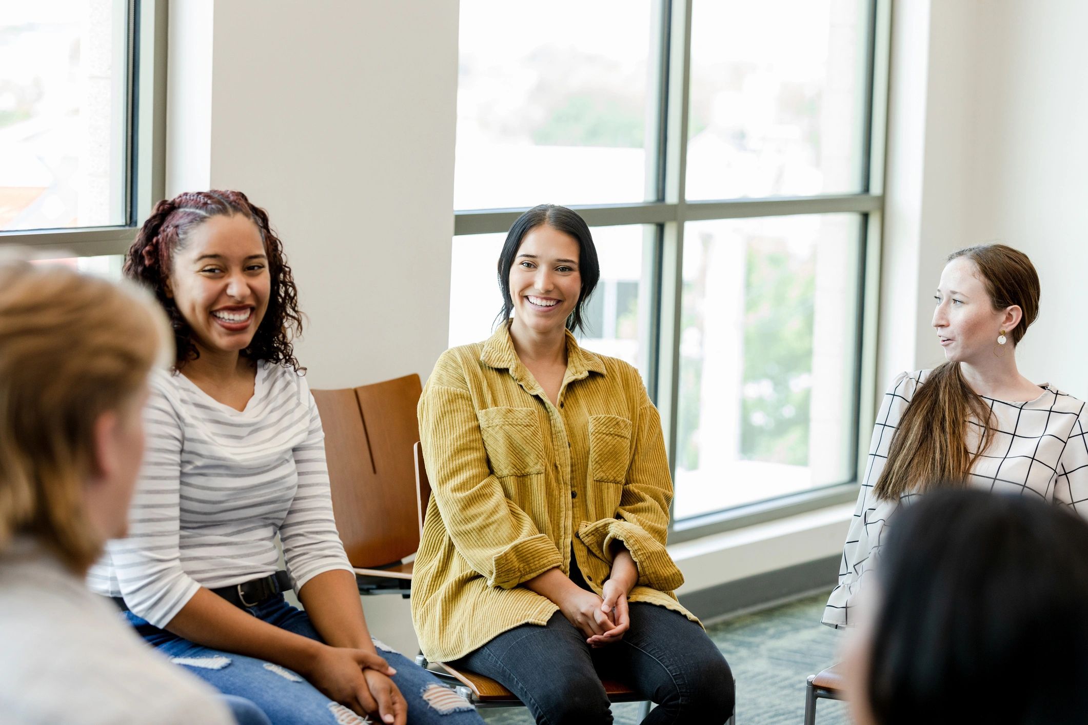 Women gathered in a supportive workshop setting