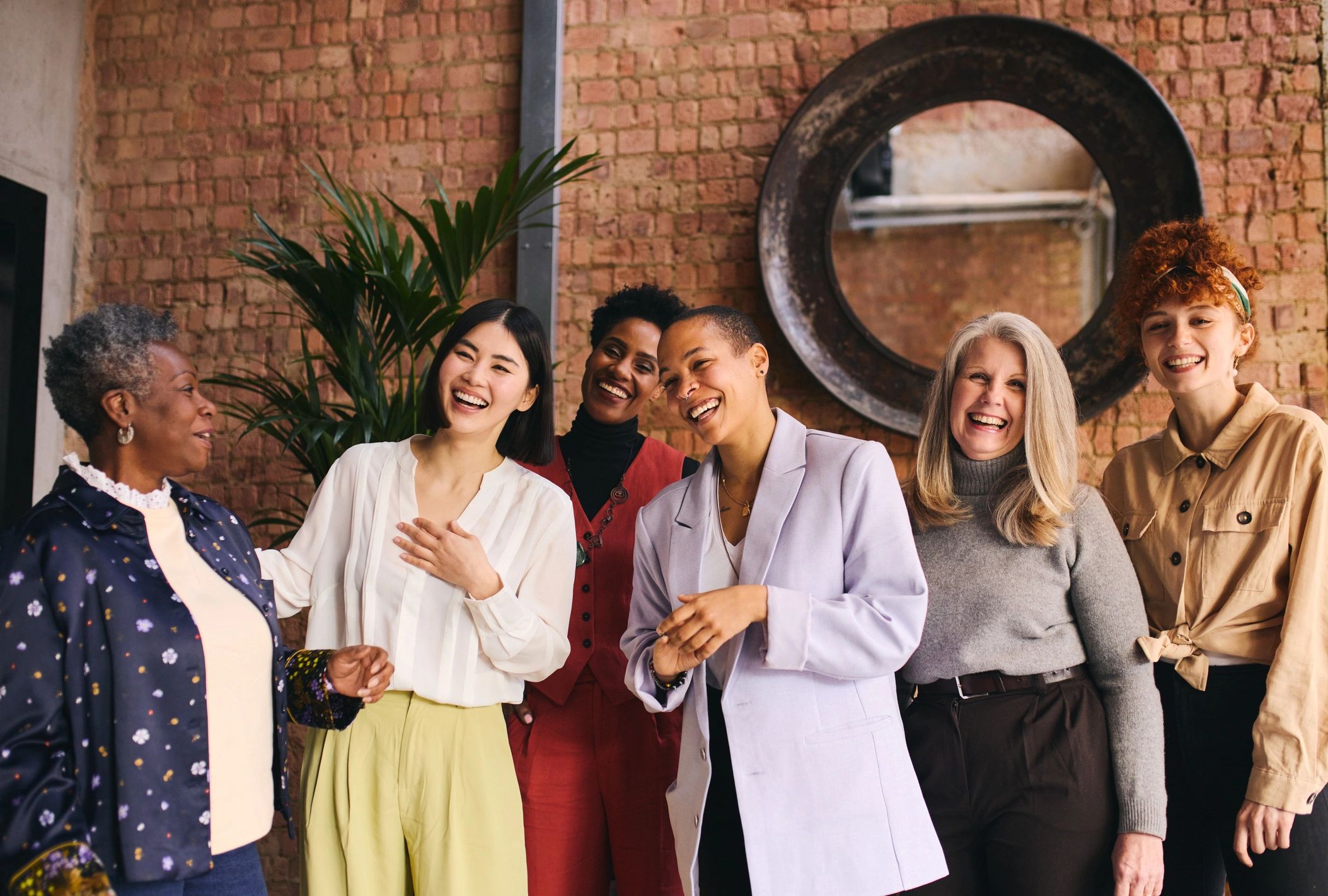 Group of women smiling together in community